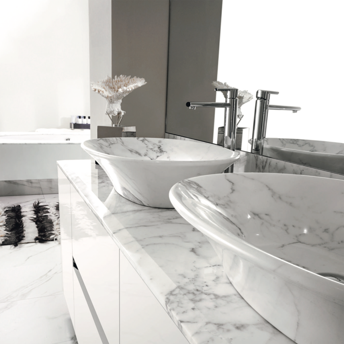 Detail of the Calacatta Vagli marble basins and top of Four Seasons White