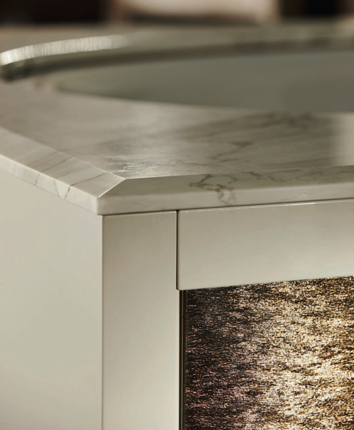 Ritz detail: golden crash-glass front beneath a faceted marble top