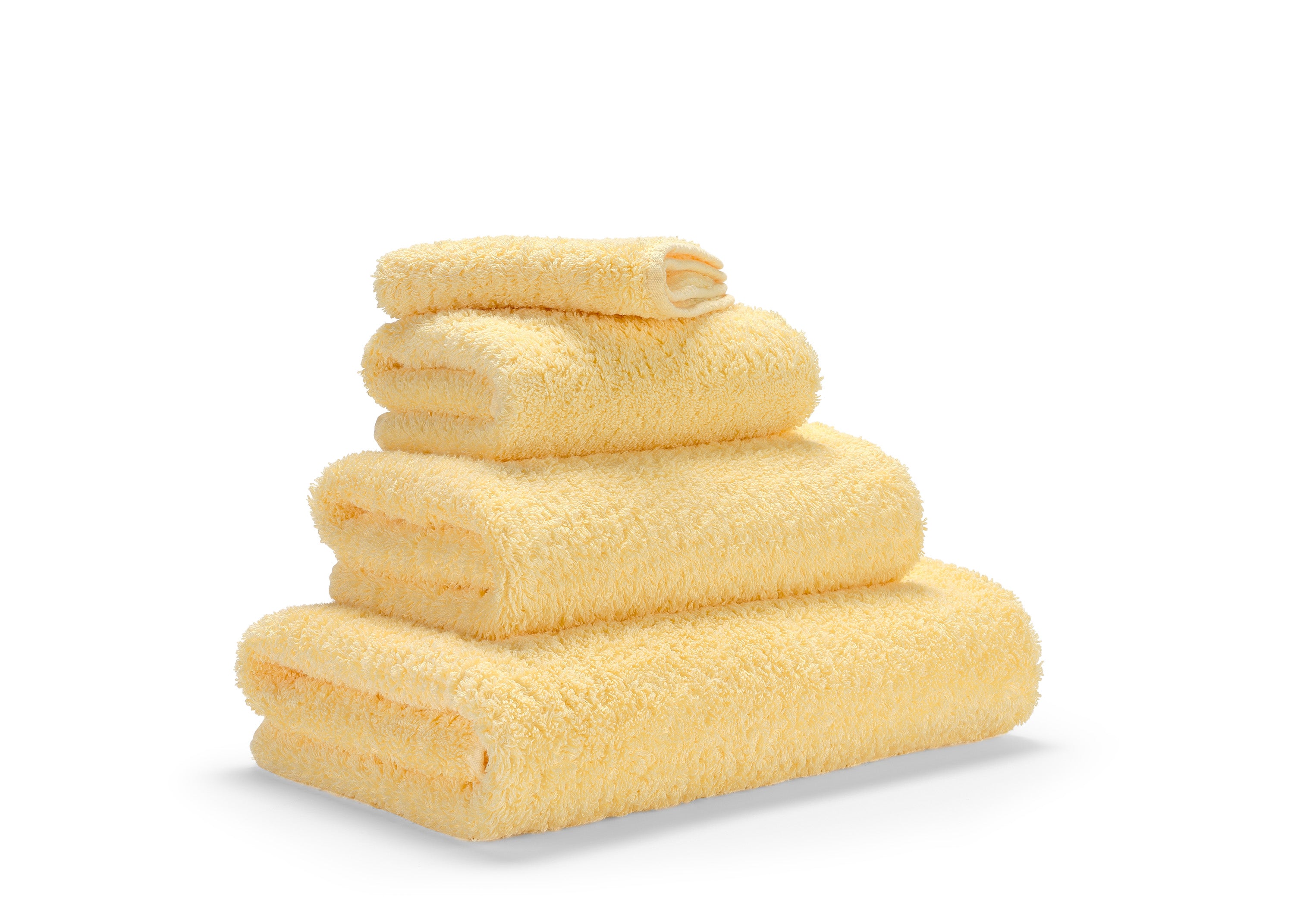 Premium-Handtuch-Set aus feinster Giza 70 Baumwolle in Gelb – luxuriöses Badtextil im Tiamont Shop, passend zu edlen Badmöbeln und stilvollen Interieurs. Handgefertigt in Portugal. 